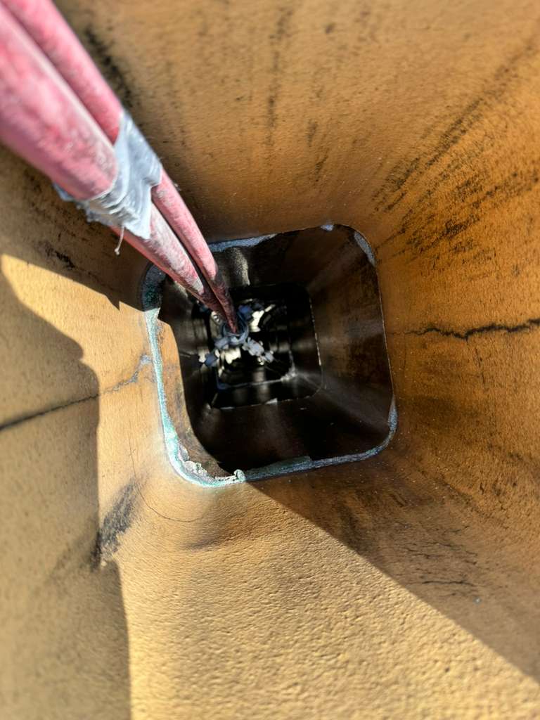 Ceramic coating application in progress inside the chimney flue