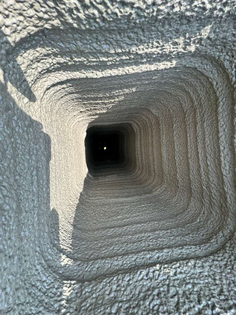 Chimney flue interior after ceramic coating, smooth protected surface
