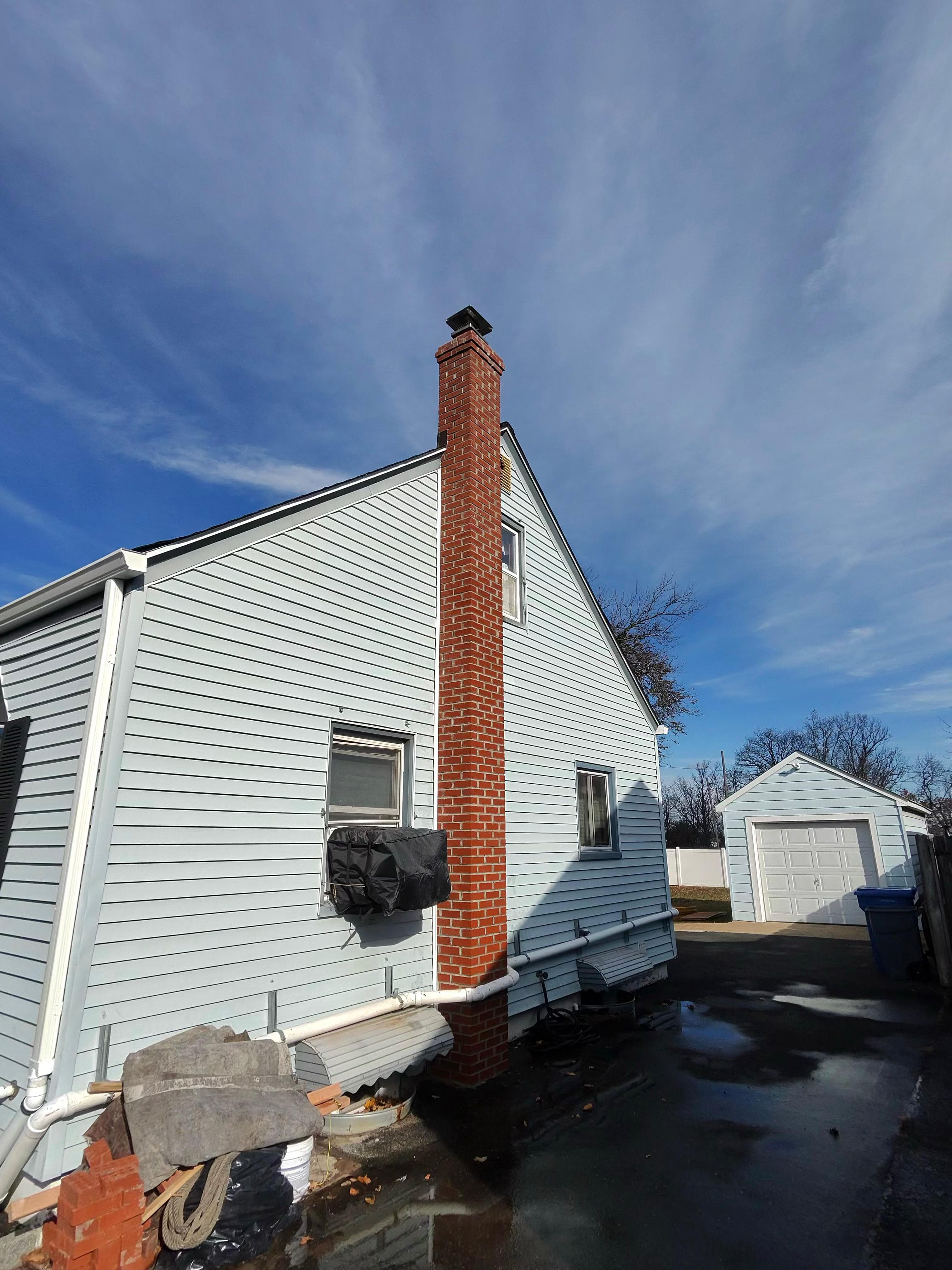 Rebuilt brick chimney with new mortar and cap