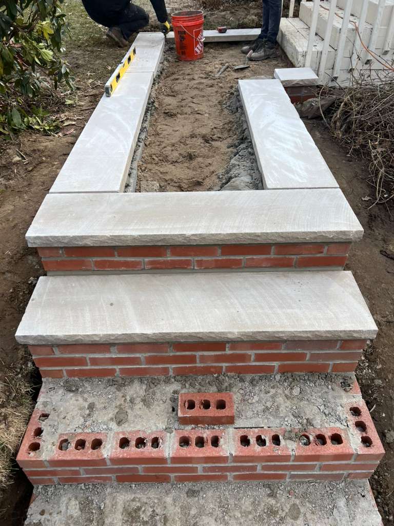Brick and stone masonry detail on a residential exterior